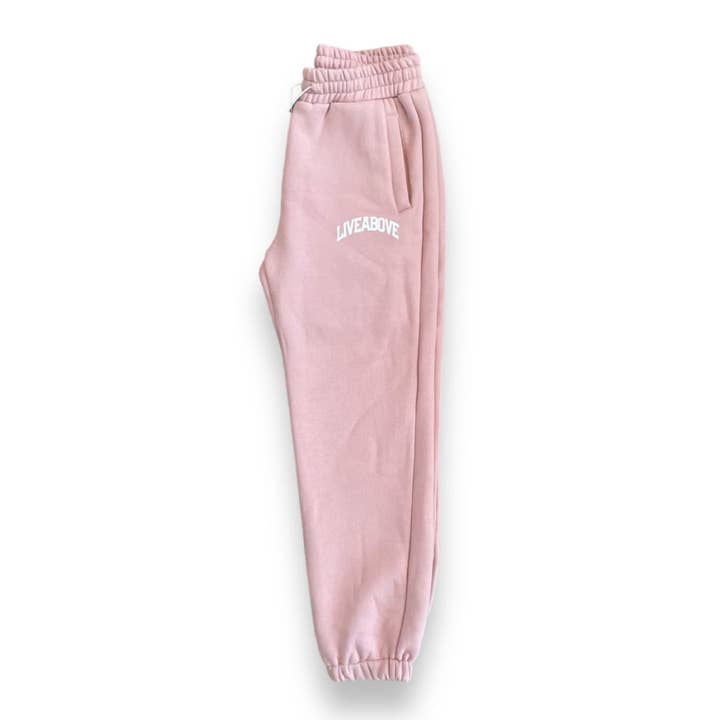 Pantaloni da jogging Live Above Arched Logo - Rose' per la vendita all'ingrosso da parte di Live Above Clothing