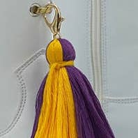 Purple & Gold Interchangeable Majorette Tassels for wholesale by Krewe Marching Co.