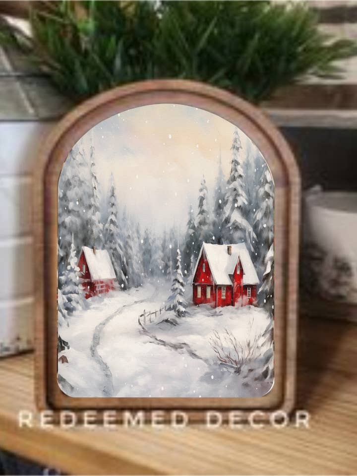 Arte incorniciata di cabine rosse innevate con tetto ad arco per la vendita all'ingrosso da parte di Redeemed Decor