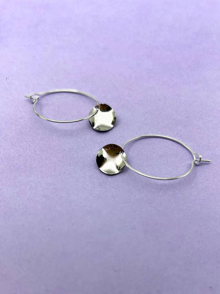 Mini Hammered Silver Disc Hoop Earrings for wholesale by Aloë Earrings