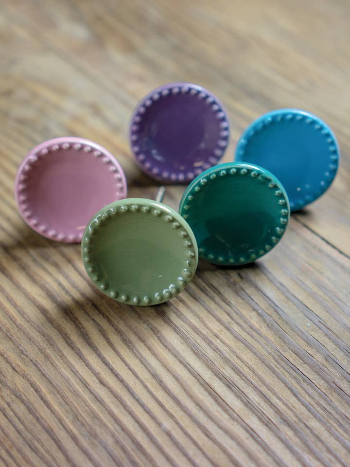 Ceramic Doorknob With Embossed Edge for wholesale by Namaste