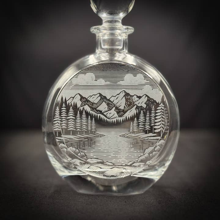 Mountains and Lake Scene - 750mL Flat Round Glass Decanter for wholesale by Adirondack Etching LLC