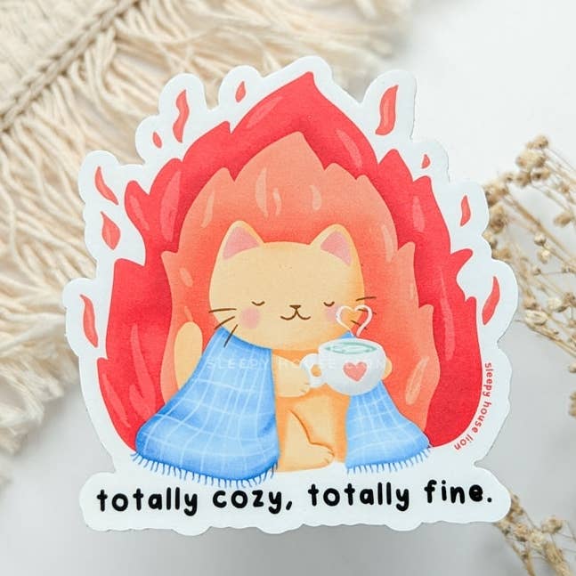 Funny Cat In Flames "Totally Cozy. Totally Fine." Vinyl Sticker (Waterproof, UV resistant, Dishwasher Safe) for wholesale by Sleepy House Lion