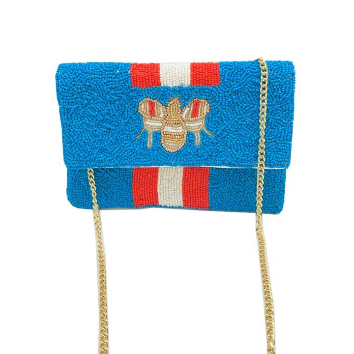 MINI BOLSO DE MANO AZUL CON ABALORIOS Y RAYAS ROJAS Y BLANCAS para venta al por mayor de Pizzazz, Inc.