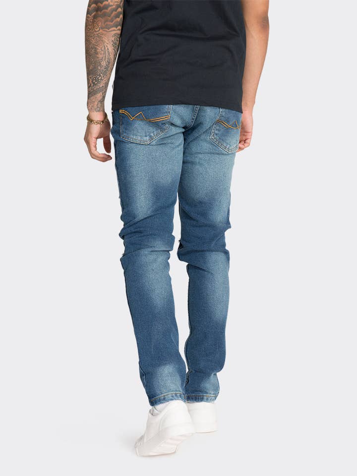 Blauwe slim fit jeans met knie voor wholesale door London Attitude