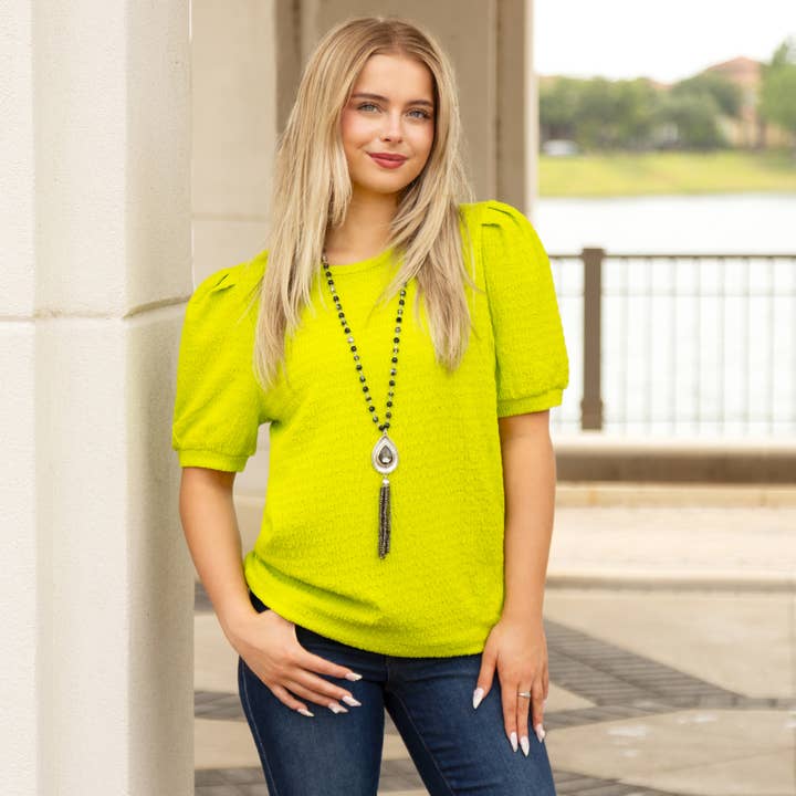 Top in tinta unita con maniche a sbuffo per la vendita all'ingrosso da parte di Your Fashion Wholesale