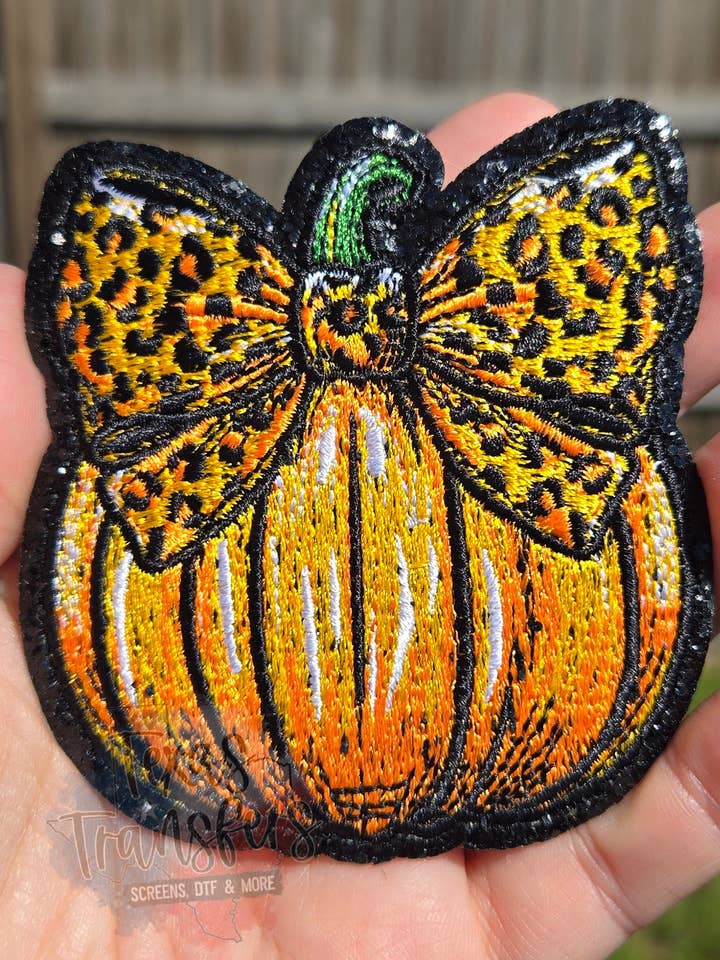 Leopard Bow Pumpkin Glitter Iron-On PATCH for wholesale by Texas Transfers