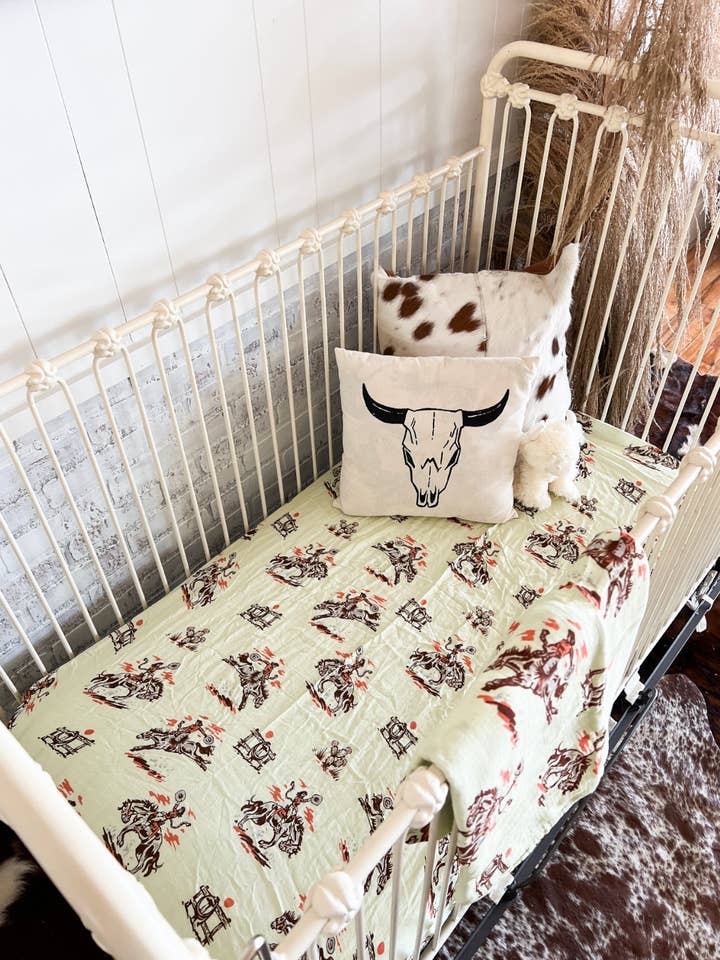 Original Sunset Cowgirl Fitted Crib Sheet 2.0 for wholesale by The Fringed Pineapple