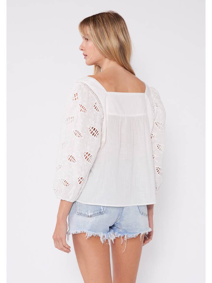 White Embroidered Cutout 3/4 Sleeve Tie Neck Blouse for wholesale on Faire