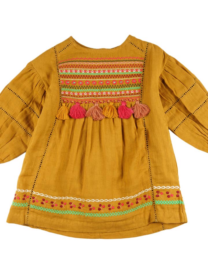 Robe fille moutarde en bambula brodée avec des pompons pour la vente par Charanga
