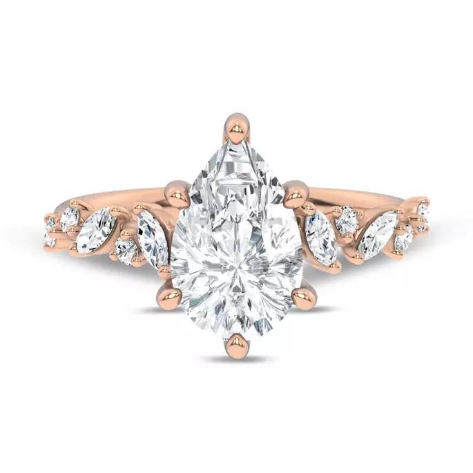 Förlovningsring med spridda diamanter och päronformad sten för wholesale av Caratina