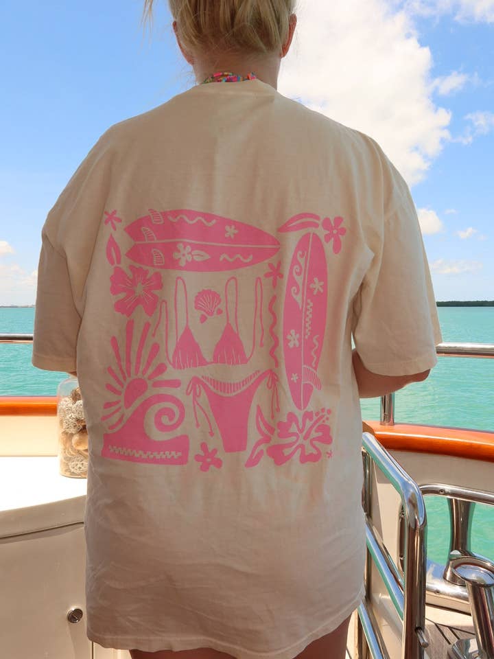 Ivory Pink Swim And Surf Comfort Colors Tee for wholesale on Faire3