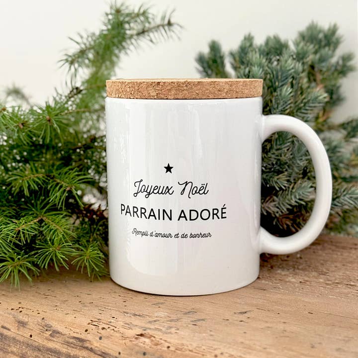 "Mug 'Merry Christmas Beloved Godfather' with its cork lid" for wholesale by Marcel & Lily
