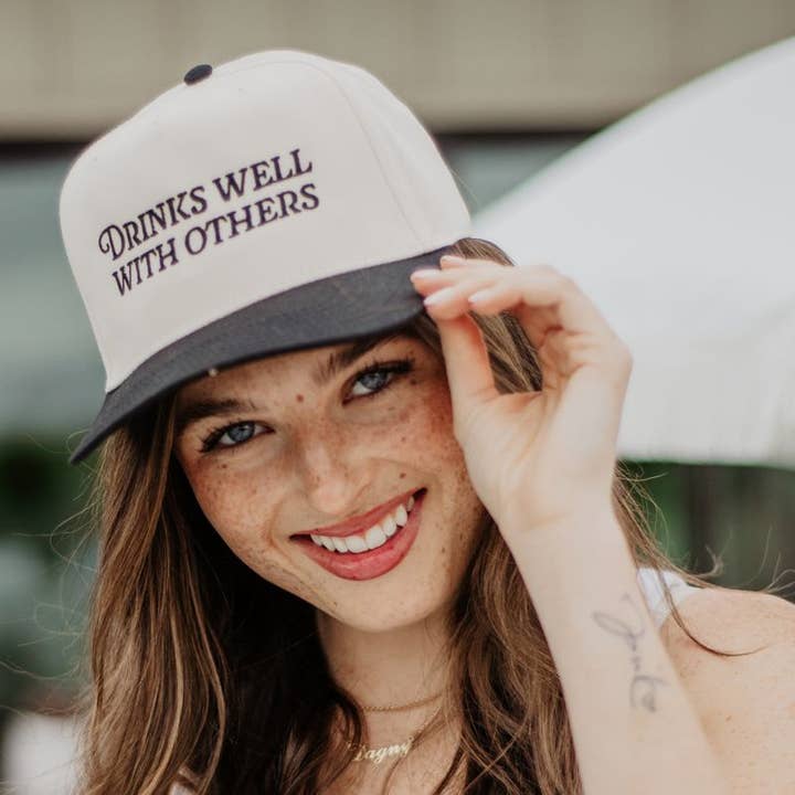 Black and Tan Drinks Well With Others Vintage Trucker Hats For Women for wholesale on Faire