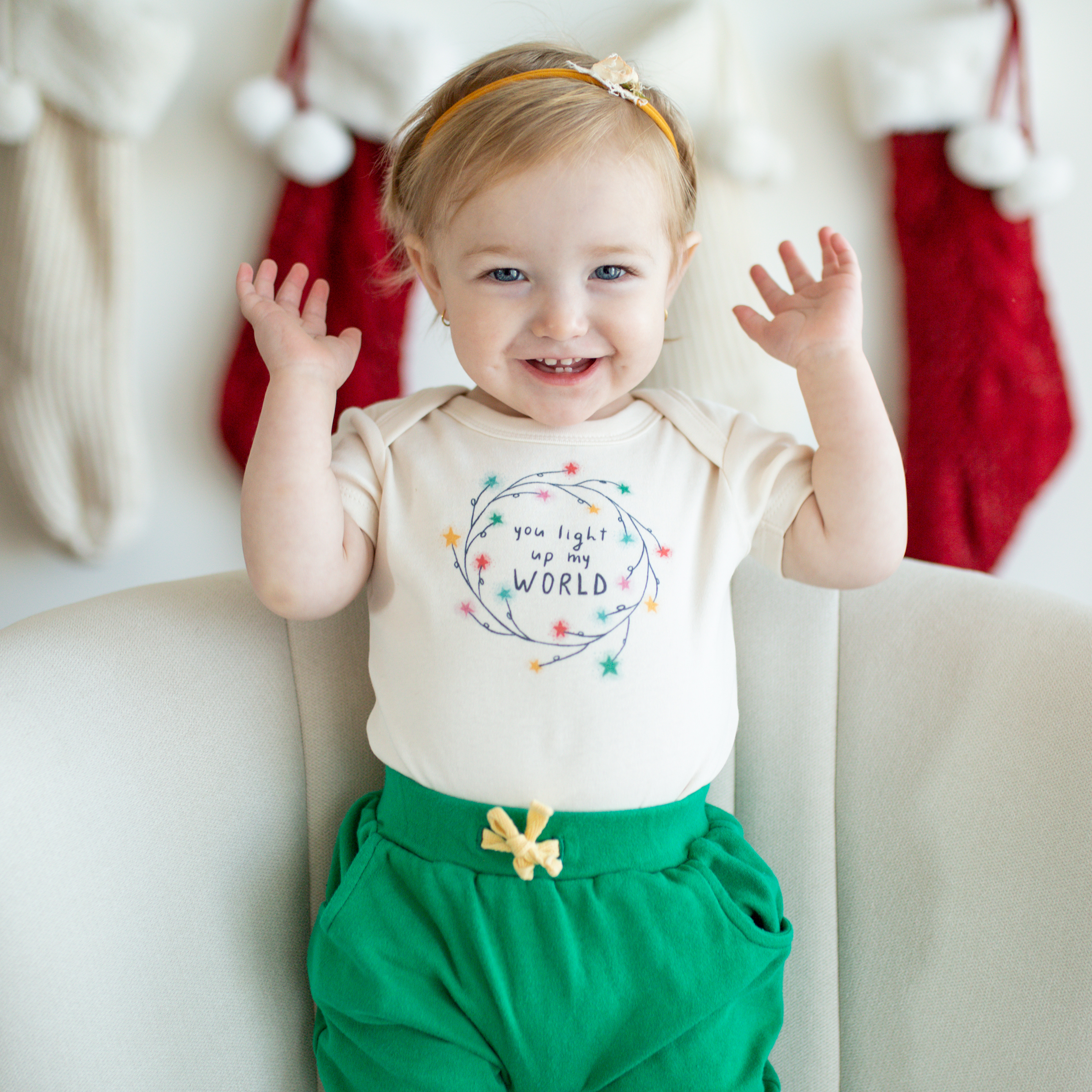 Default Christmas baby graphic organic bodysuit | light up my world for wholesale on Faire1