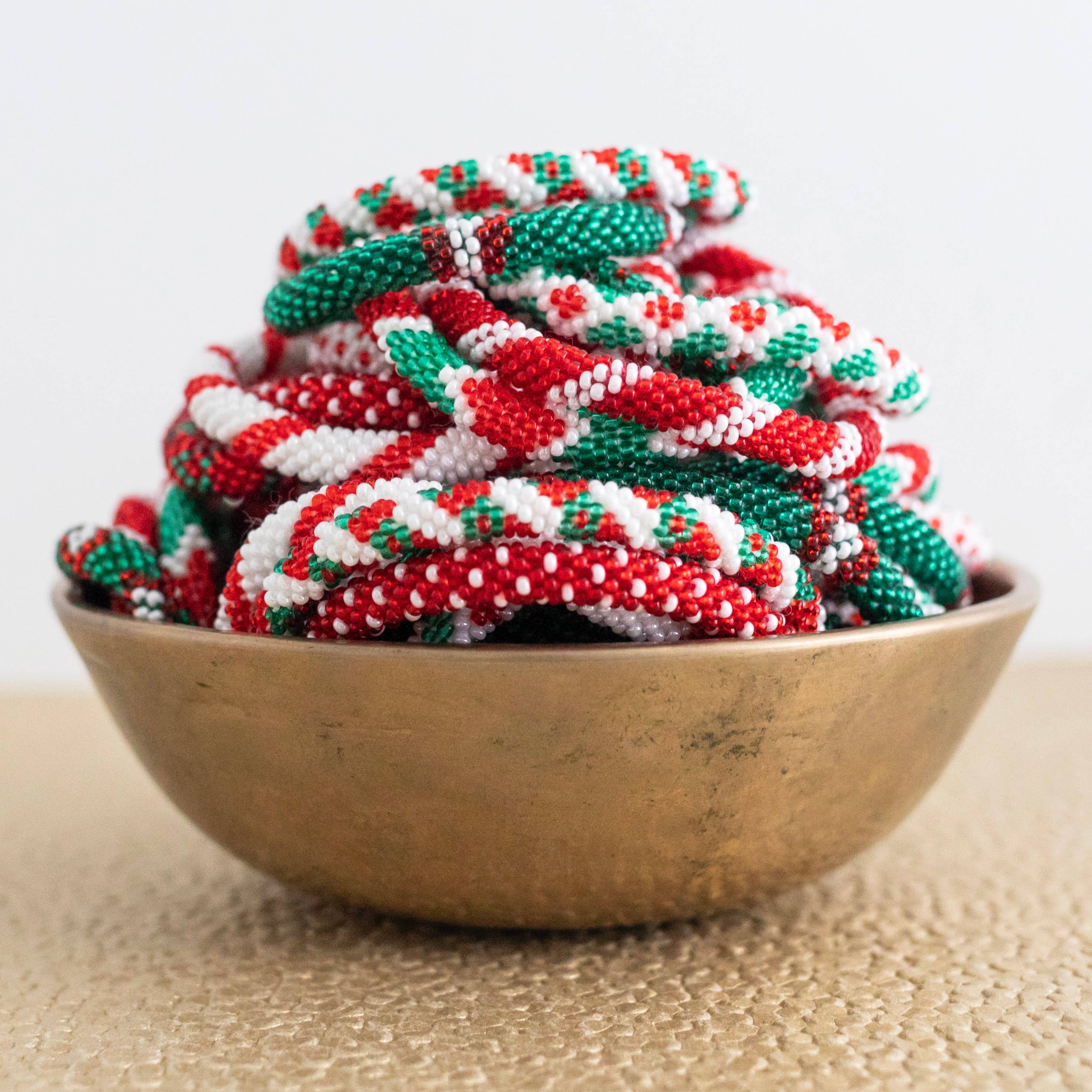 Aid Through Trade - Wholesale Jewelry Set - Roll-On® Christmas Bracelets (Mistletoe) - Set of 122