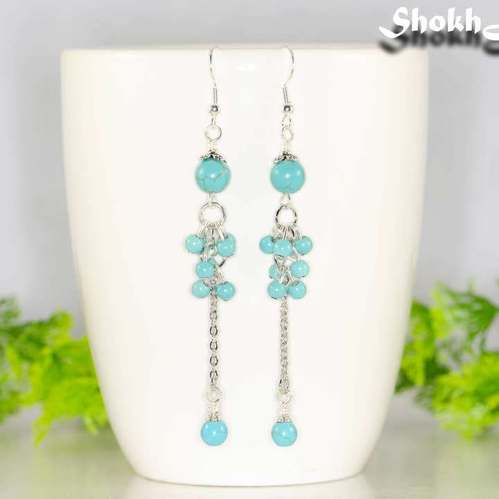 Boucles d'oreilles extra-longues en howlite turquoise pour la vente par Shokh Jewelry