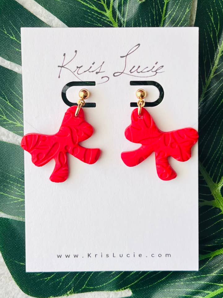 Rode strik oorbellen voor wholesale door Kris Lucie