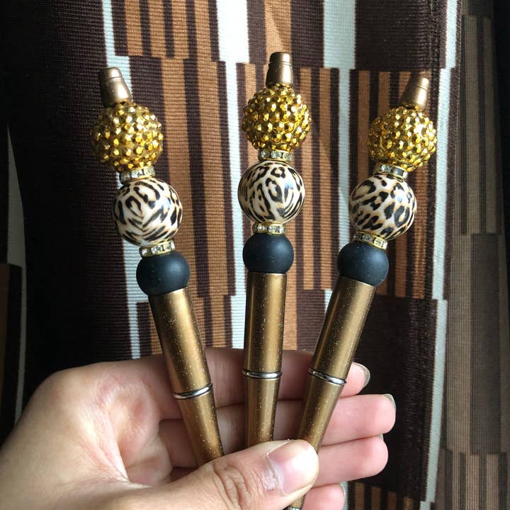 Penna con ghepardo marrone scintillante «Extreme Leo» per la vendita all'ingrosso da parte di Amy Designs