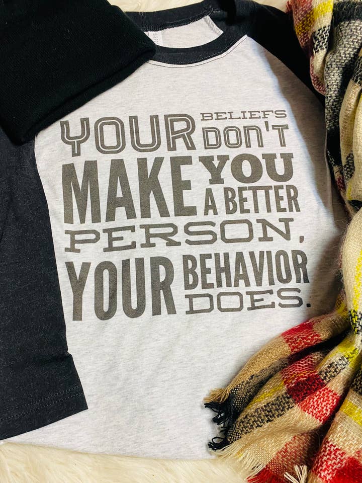 Your beliefs don’t make you a better person raglan for wholesale by Neat Creations