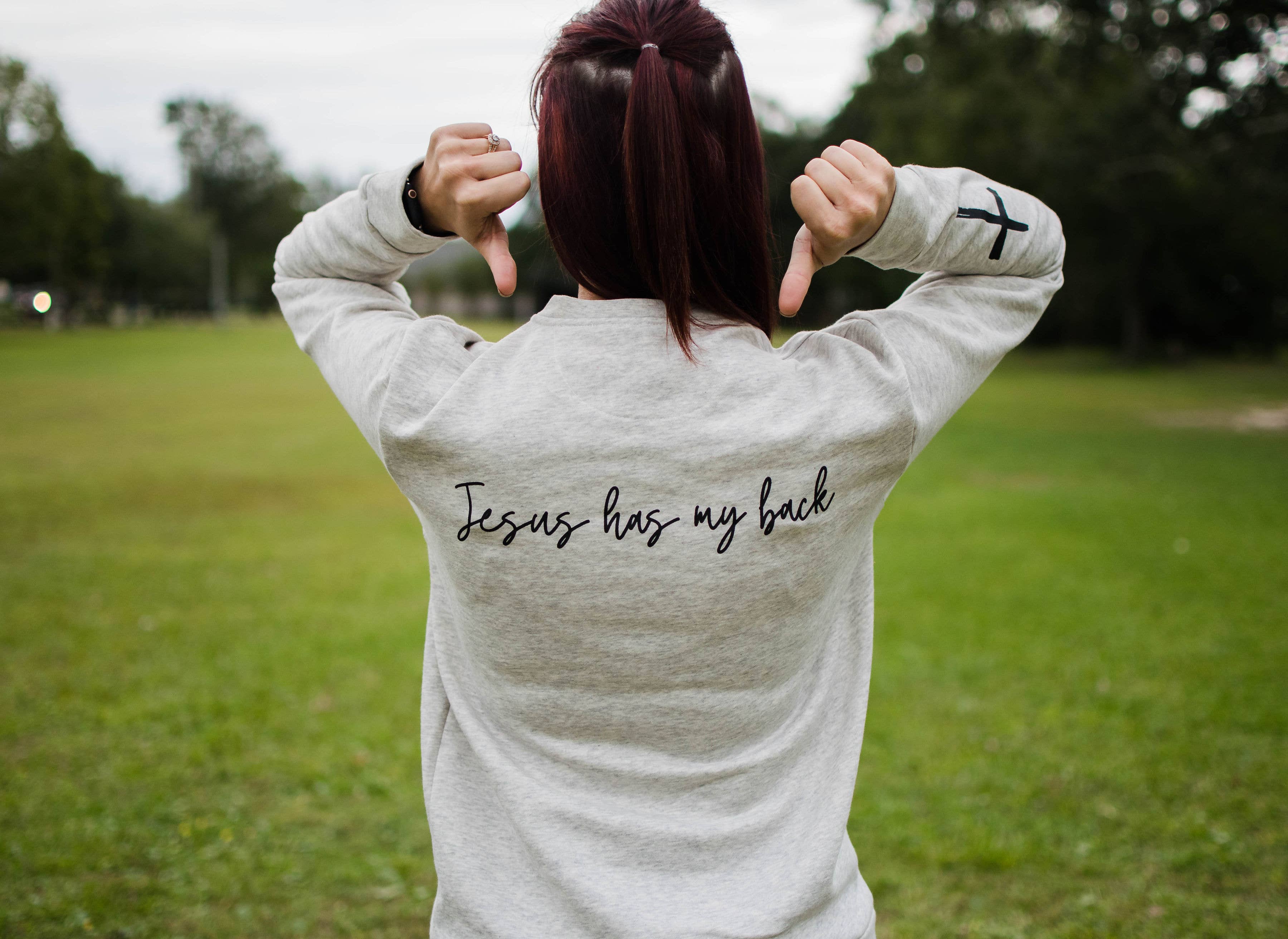 Rosebud Boutique - Wholesale Graphic Sweatshirt - Women's - Jesus Has My Back Sweater1