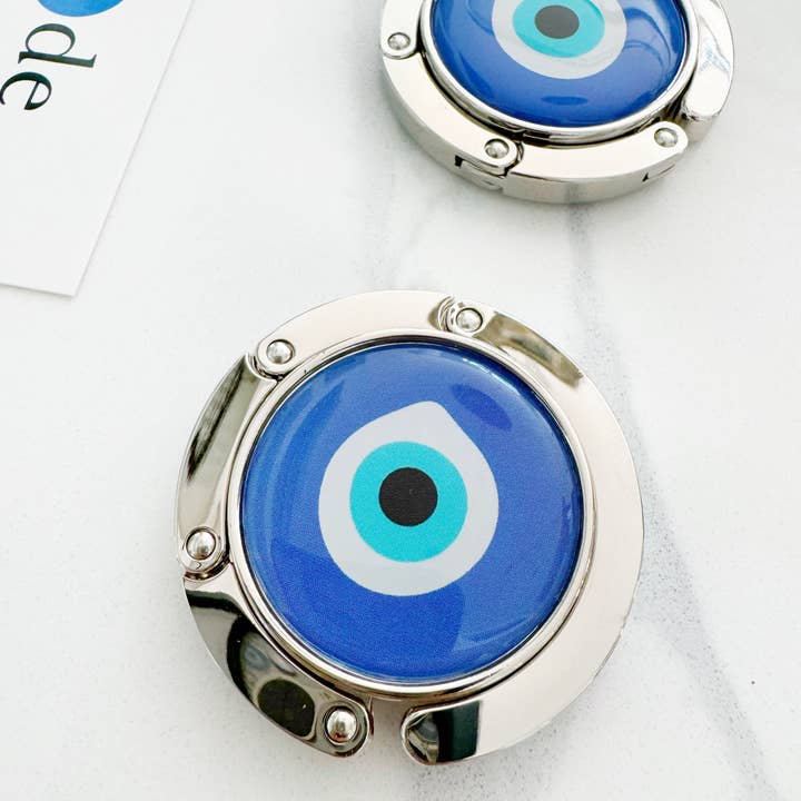 Evil Eye Handbag Purse Hook Hanger and other Purchase Wholesale evil eye bag. Free Returns & Net 60 Terms on Faire trending on Faire.
