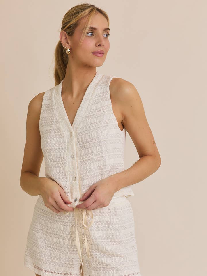 CREAM BUTTON UP SLEEVELESS CROCHET TOP AND WAIST TIE CROCHET SHORT for wholesale on Faire
