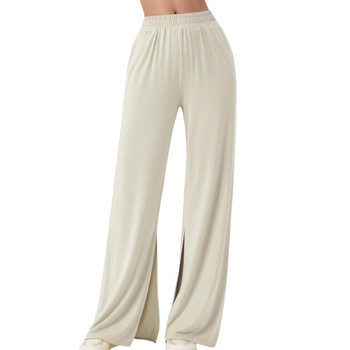 Pantalon à jambes larges avec taille élastique et ourlet fendu sur le côté pour la vente par Active by Anna-Kaci