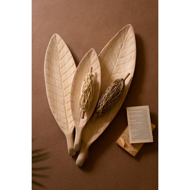 Natural SET OF THREE WOODEN LEAF TRAYS for wholesale on Faire1