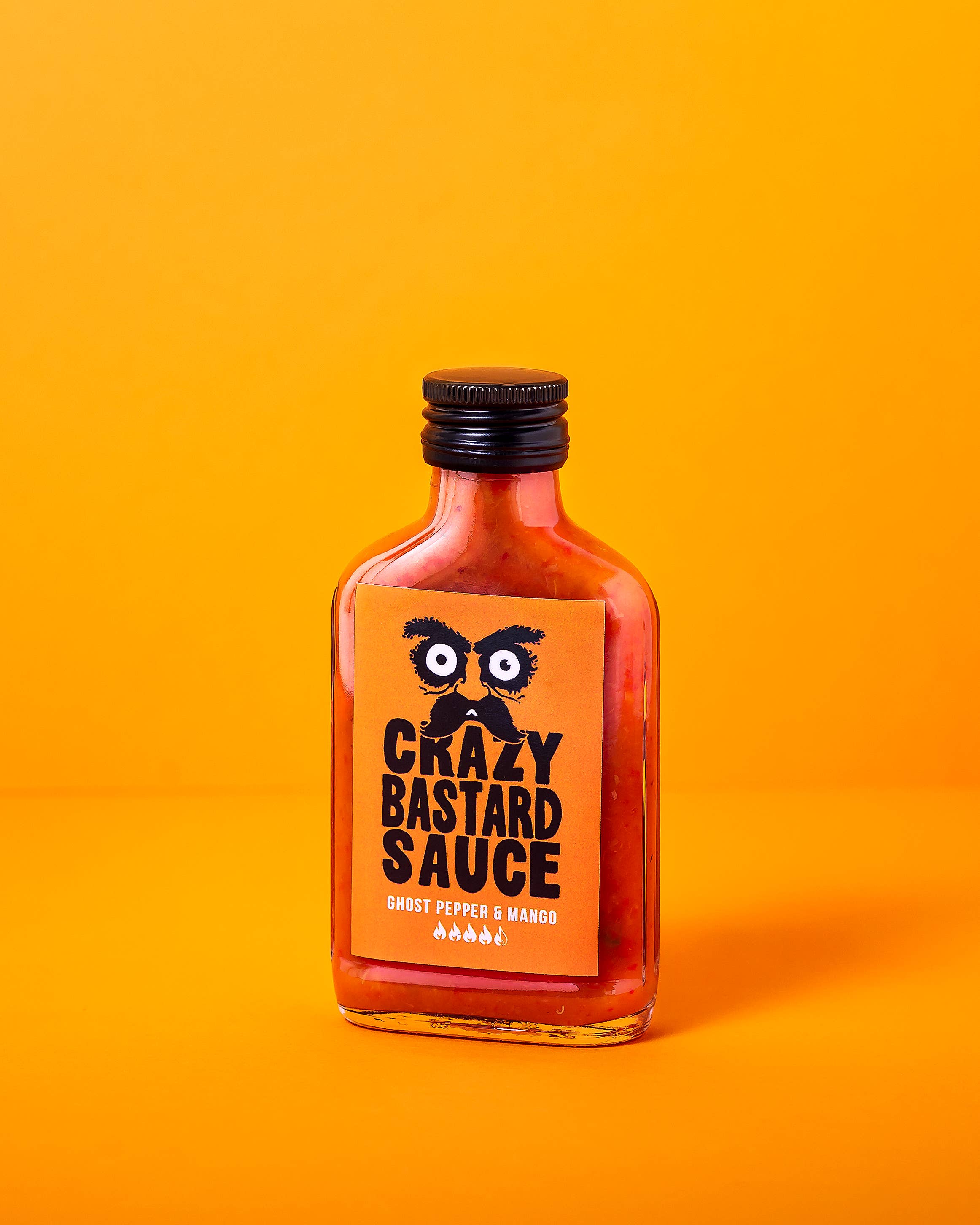 CBS Foods GmbH (Crazy Bastard Sauce) – wholesale Stark sås – Crazy Bastard Sauce Ghost Pepper & Mango het sås 100 ml1
