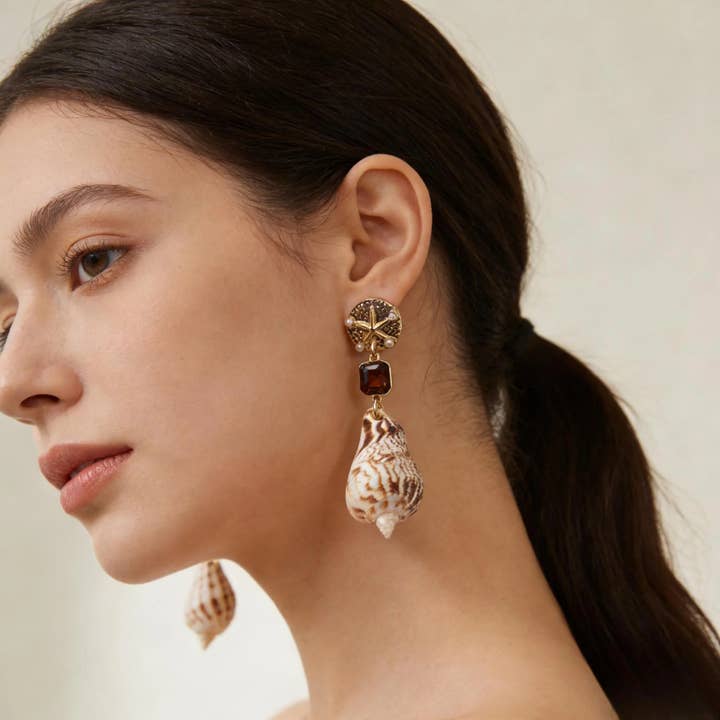 Örhängen med naturlig snäcka och bärnsten kristall för wholesale av IngrossoZagatto by INCI SRL