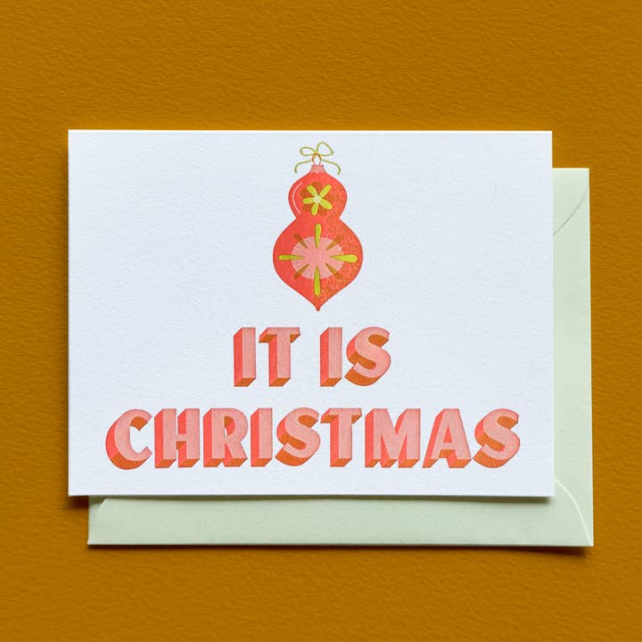 Es tarjeta de Navidad para venta al por mayor de Laughing Owl Press Co.