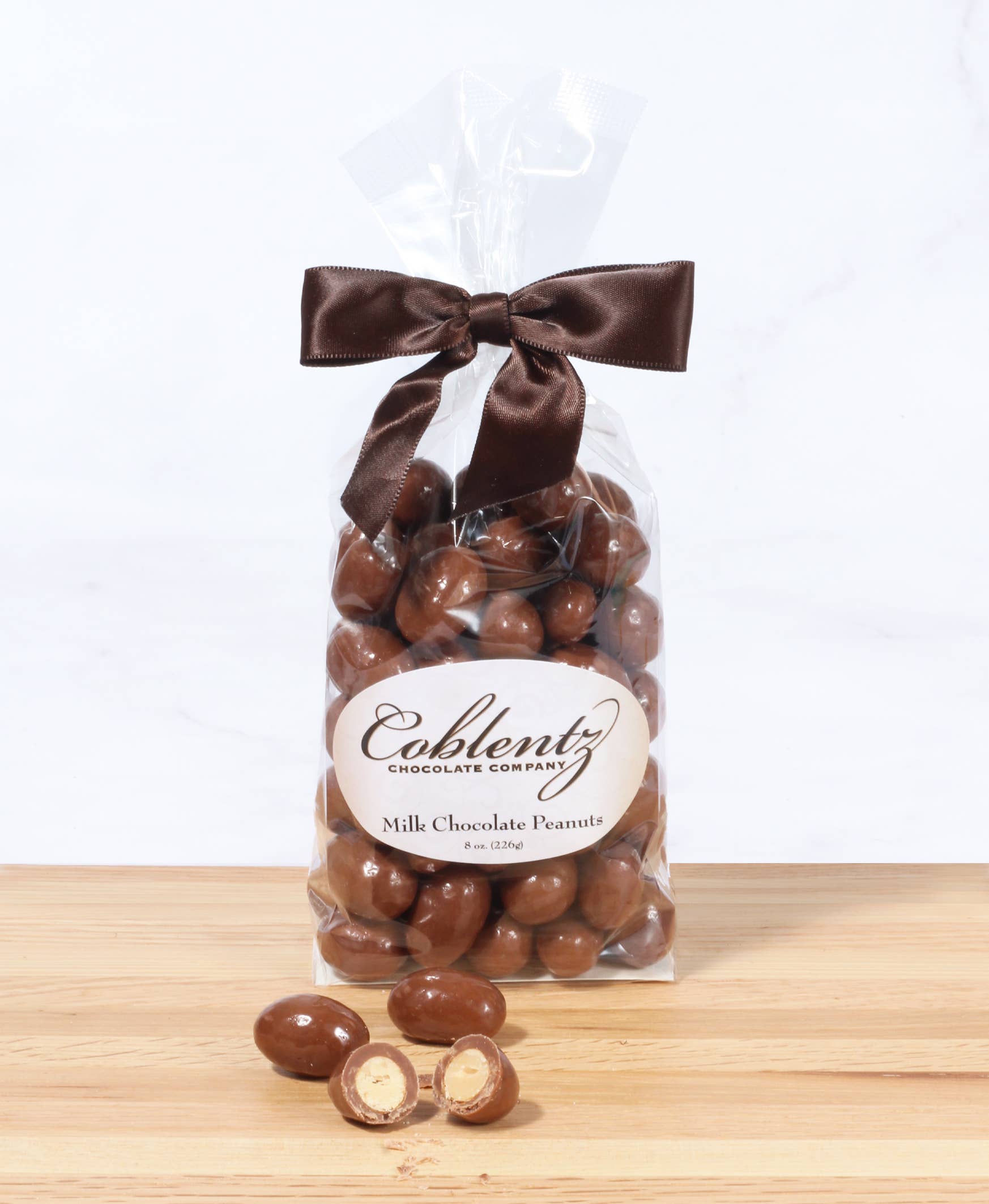 Coblentz Chocolate Company - Wholesale Chocolate Covered Sweets - Milk Peanuts Bag With Bow