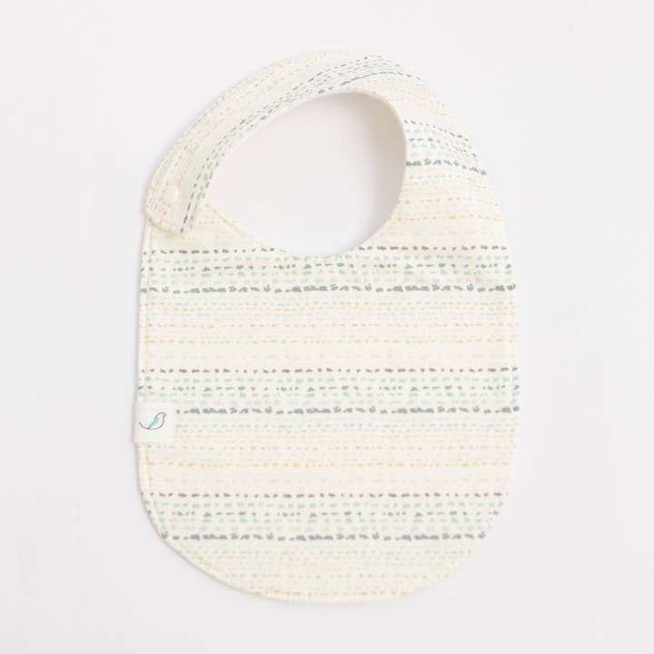 Charlie Snap Bib - Sandstone for wholesale by Hemming Birds