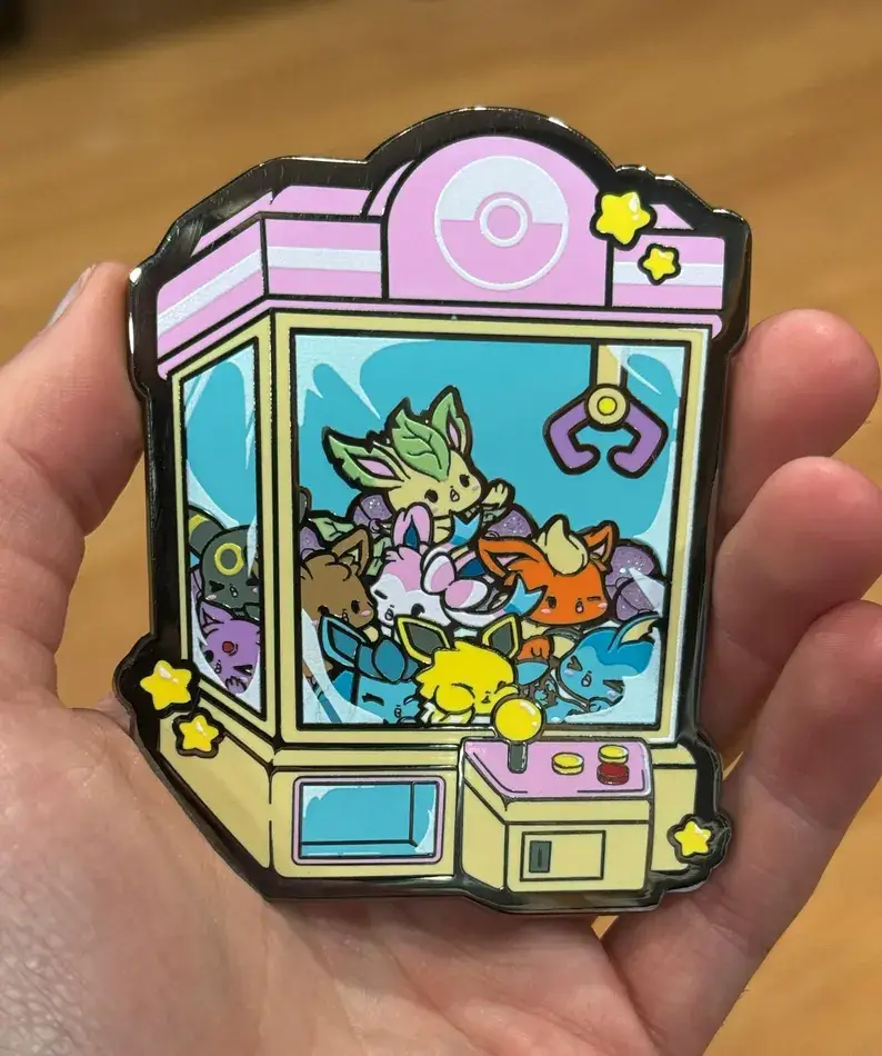 GoopyGoblins - Wholesale Lapel Pin/Button - Eeveelutions Claw Machine 3.5" Hard Enamel Pin1