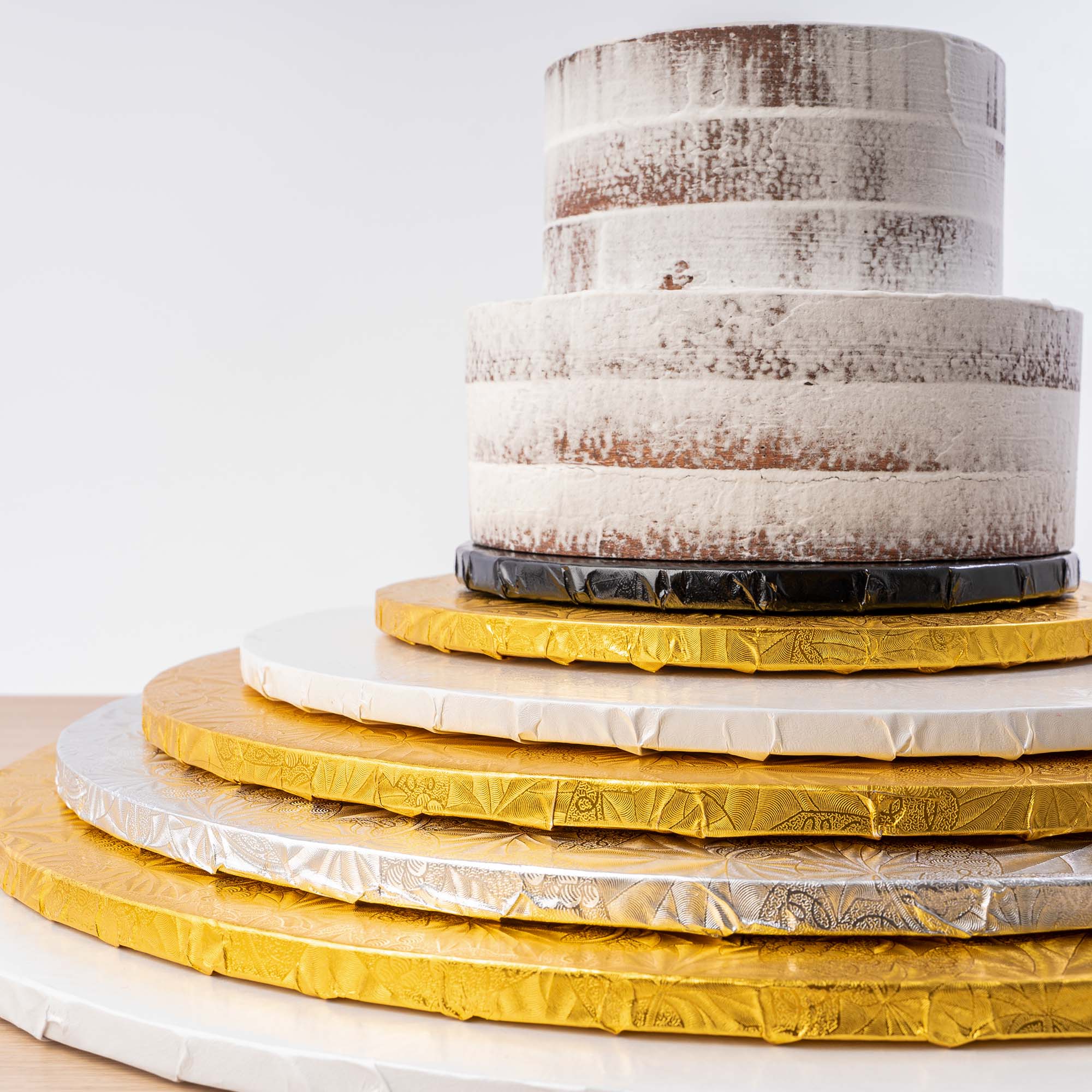 Filigree Round Cake Board 10" - Set of 5 - White for wholesale on Faire6