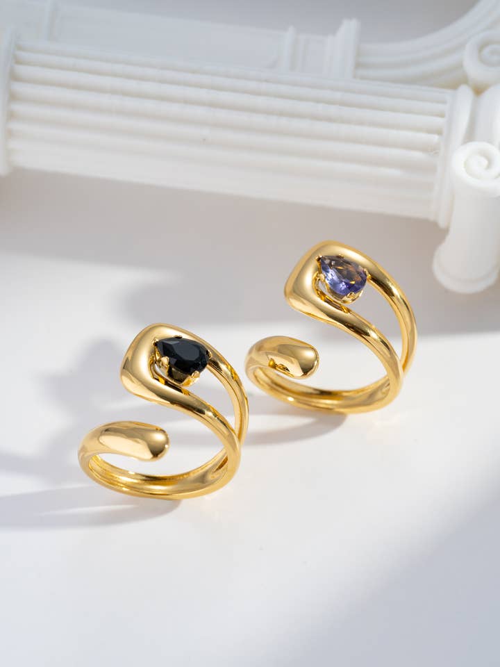 Elegant adjustable gold women's ring with black and purple stone for wholesale by COSMOS
