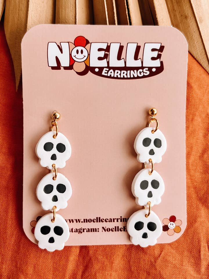 Triple Skull Dangle Earrings for wholesale by Noelle Earrings