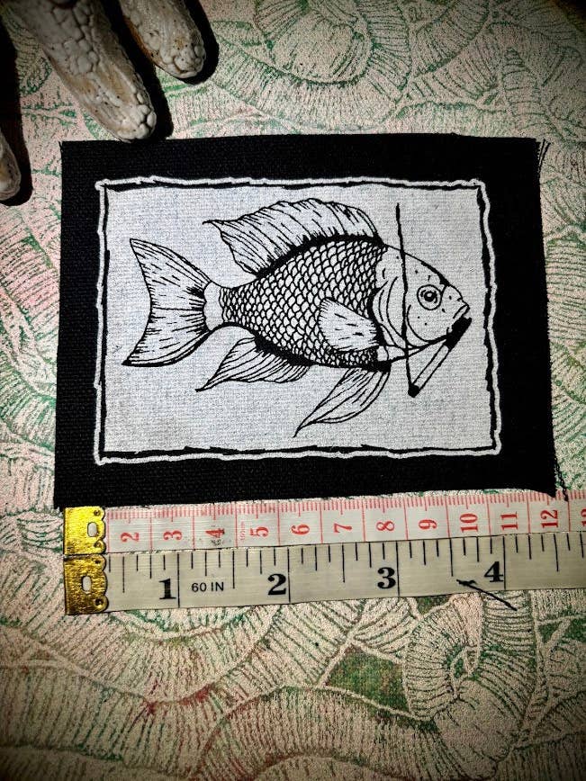 Fish smoking a cigarette patch. for wholesale by Three Raccoons