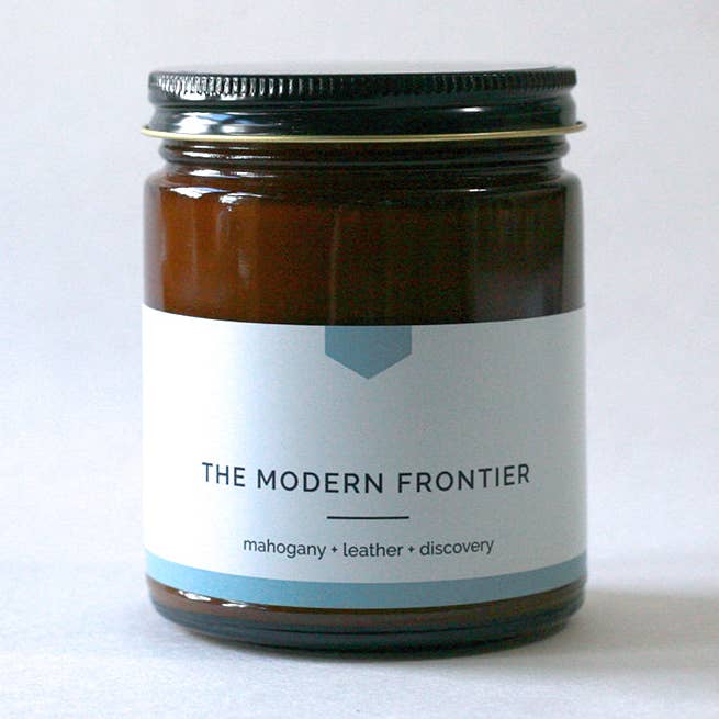 THE MODERN FRONTIER Amber Jar Soy Candle - Mahogany + Leather, Hand-Poured (9 oz) - COLLAB for wholesale by Vacant Wheel