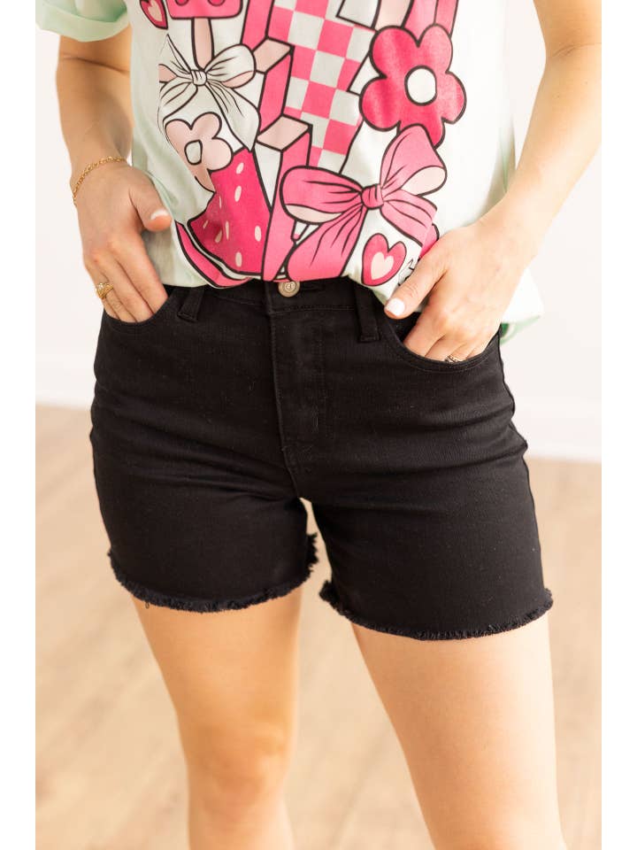 The Lola Black Distress Denim Shorts for wholesale on Faire