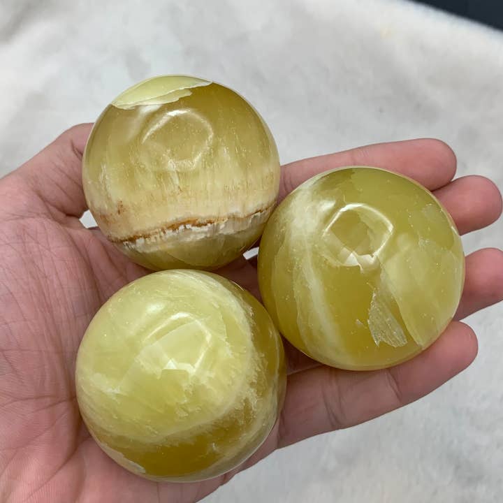 LEMON CALCITE SPHERES BIG (60MM - 65MM) for wholesale by Metaphysical & Healing Crystals