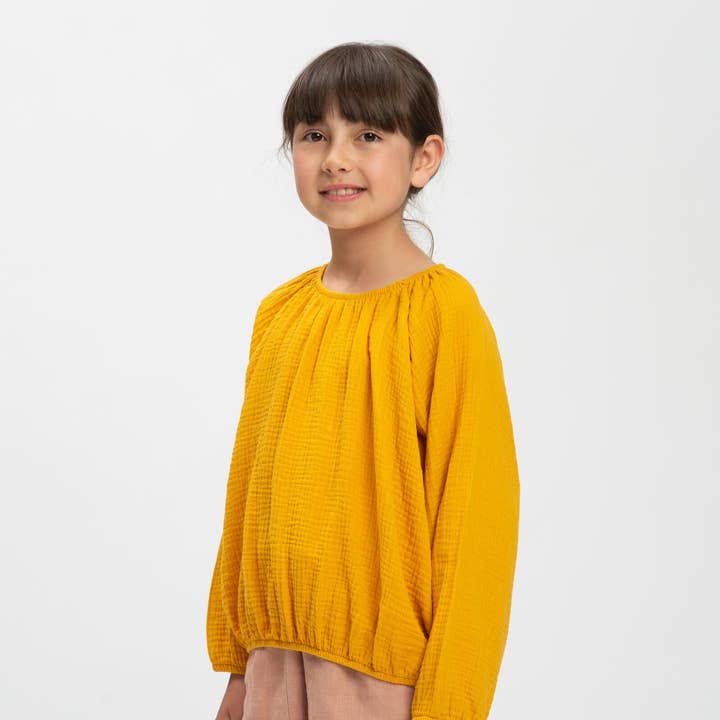Blusa a palloncino color calendula per la vendita all'ingrosso da parte di Matona