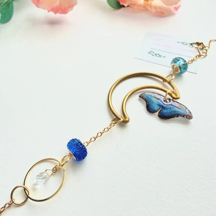 D. Prince Designs - Wholesale Suncatcher - Handmade + Hand-Illustrated Blue Morpho Butterfly Suncatcher with Blue Beads1