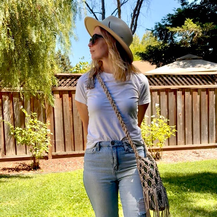 Handmade Macrame water bottle holder for sizes up to 40oz and other Purchase Wholesale water bottle holder with strap. Free Returns & Net 60 Terms on Faire trending on Faire.