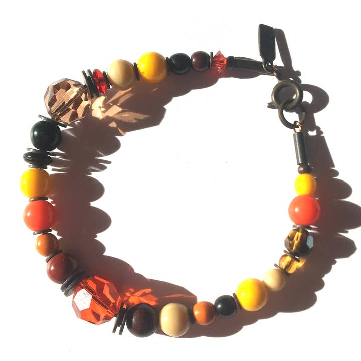 BORN TO RULE BRACELET - GLASS, CRYSTAL, BRONZE, SMOKE TOPAZ for wholesale by Owen Glass Collection