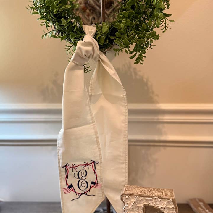 Fourth of July Crest with Initial Embroidered on Wreath Sash for wholesale by Oh Stitch, Please LLC