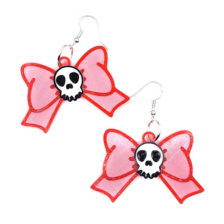 Orecchini a fiocco con teschio rosa stampati in 3D per la vendita all'ingrosso da parte di Printy Vibes