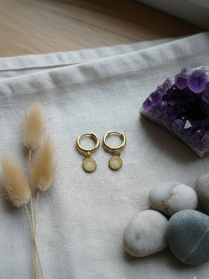 Sunburst charm Gold Huggie hoops for wholesale by Sonqo