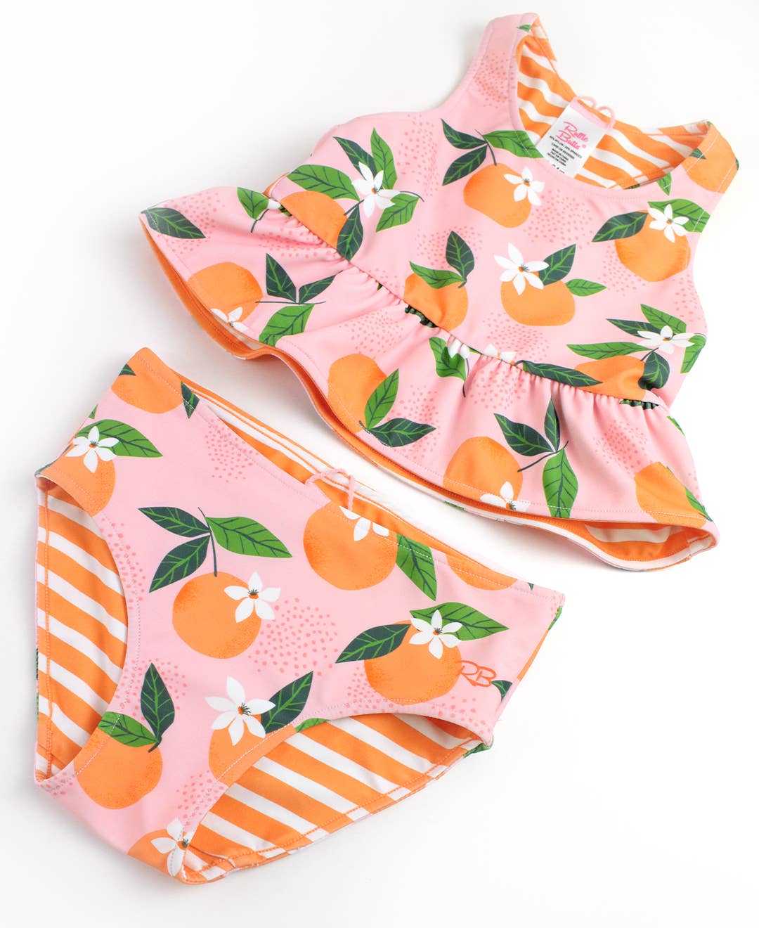 Rosa Conjunto de bañador de dos piezas con peplum reversible "Orange You The Sweetest" para niñas. de venta al por mayor en Faire5